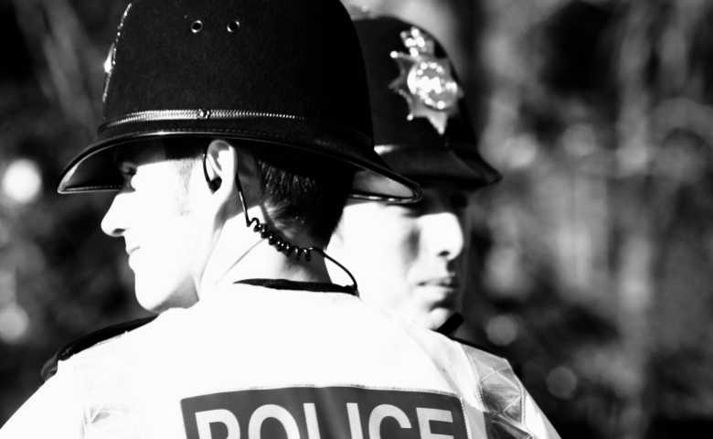 A black and white image of two police officers
