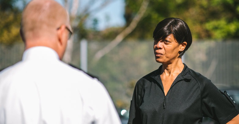Officers facing each other talking