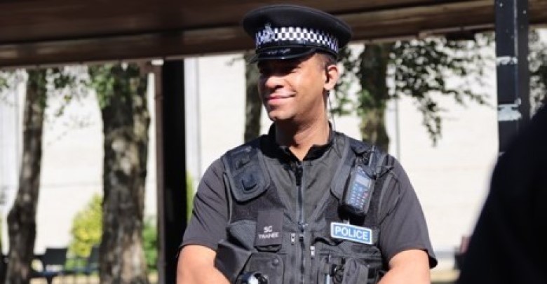 An officer smiling