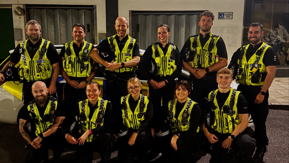 Group of police officers posing for a group photo