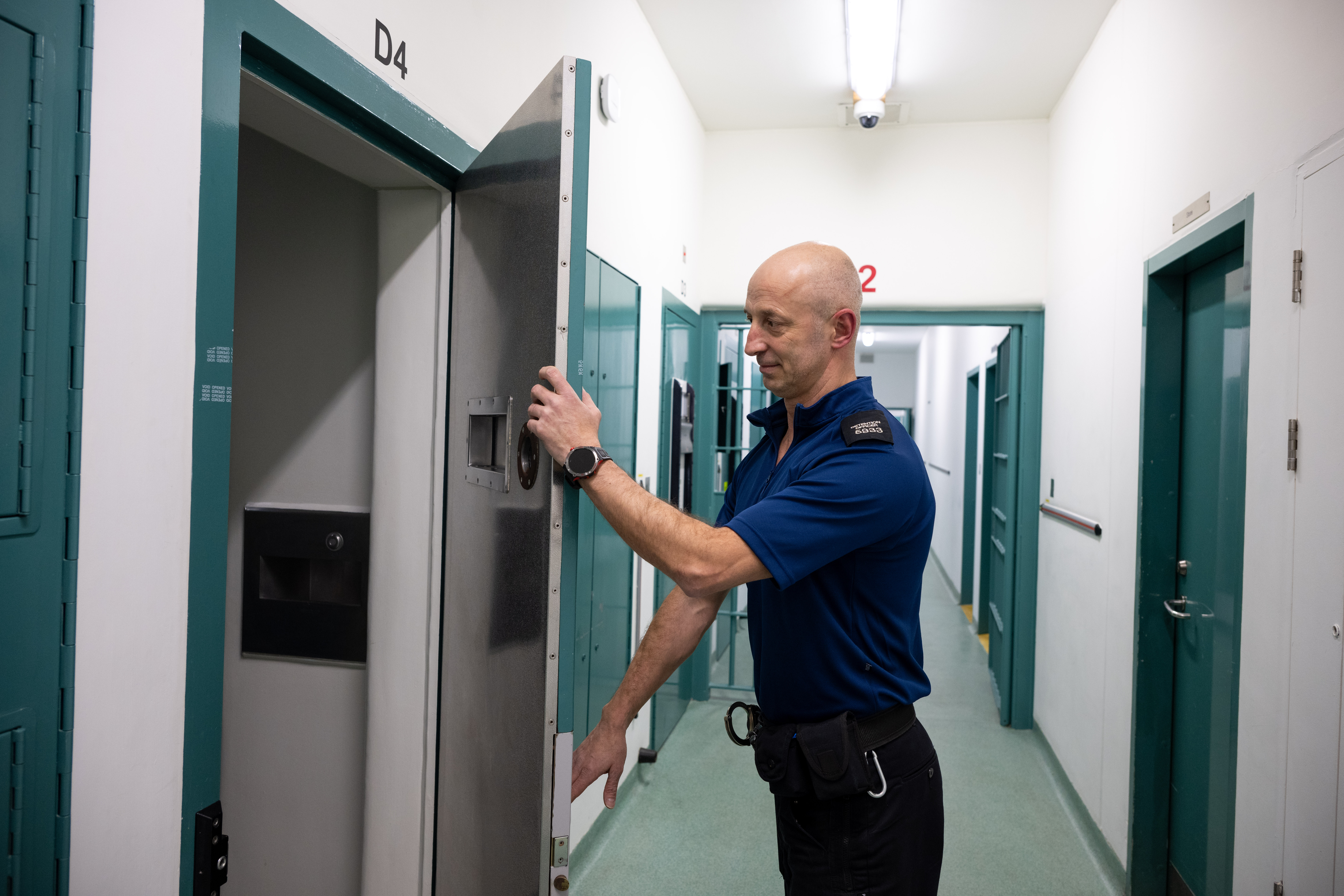 Detention Officer opening a door