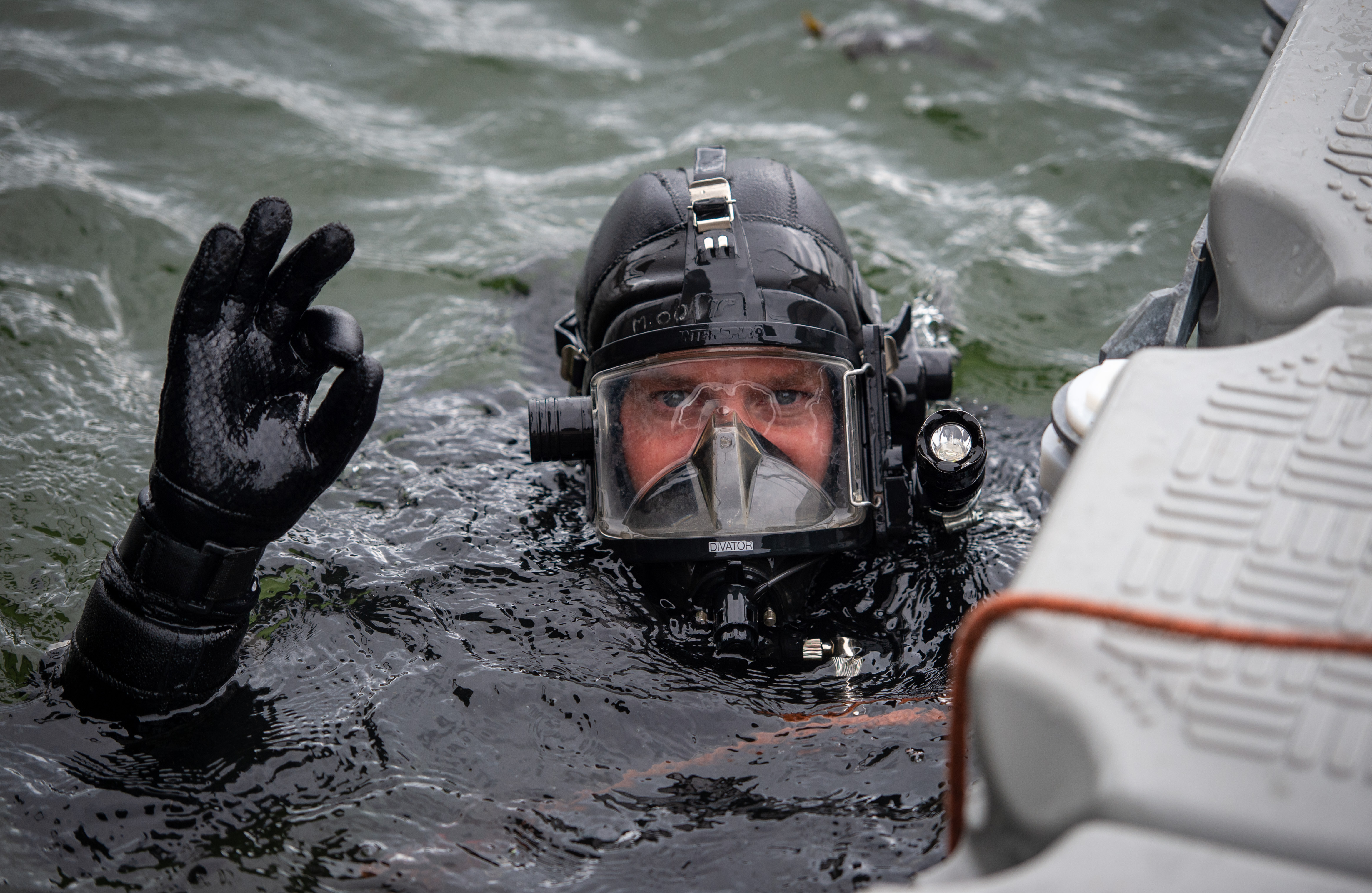 Male police diver in the water