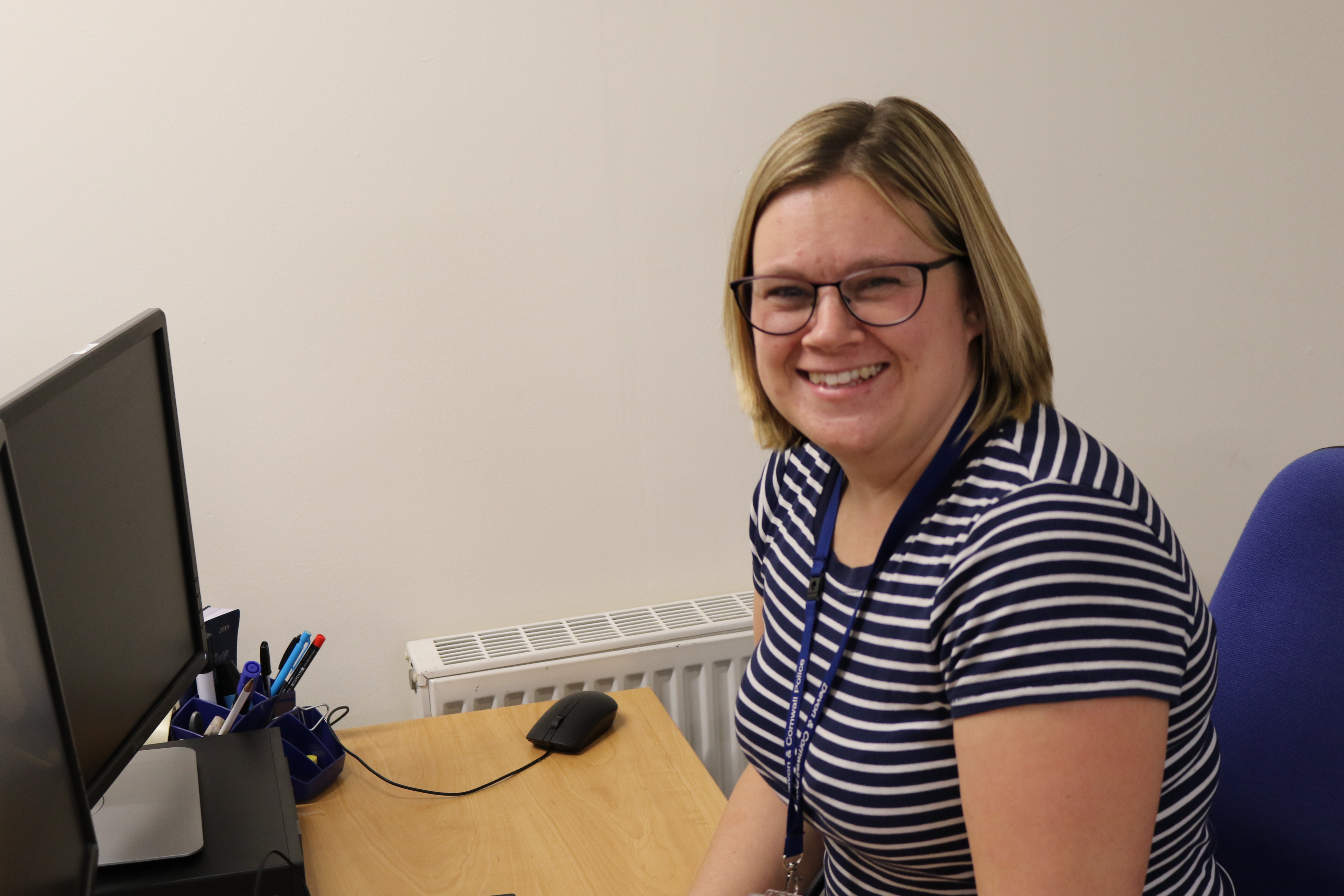 Female Detective sat at a desk