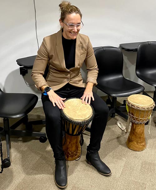 Playing a djembe
